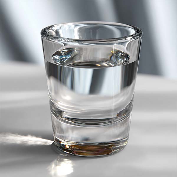 1.5 fl. oz. clear distilled spirits in a shot glass, labeled 40% ABV